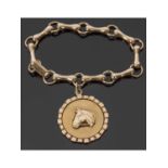 9ct gold bracelet and horse pendant, a design featuring horse bit links suspending a large