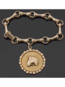 9ct gold bracelet and horse pendant, a design featuring horse bit links suspending a large
