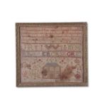 19th century needlework sampler decorated with extensive rows of letters and numbers and a large