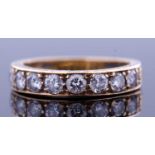18ct gold and diamond half eternity ring, channel set with eight round brilliant cut diamonds,
