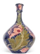 Bursley ware seed poppy vase designed by Charlotte Rhead, 33cm high