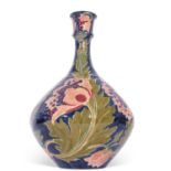 Bursley ware seed poppy vase designed by Charlotte Rhead, 33cm high