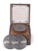 A small late 19th century Fairy polyphon in stained wooden case, complete with box of metal discs,