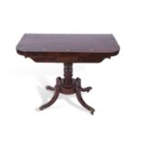 Regency rosewood and brass inlaid card table with folding rectangular top, the top opening to a