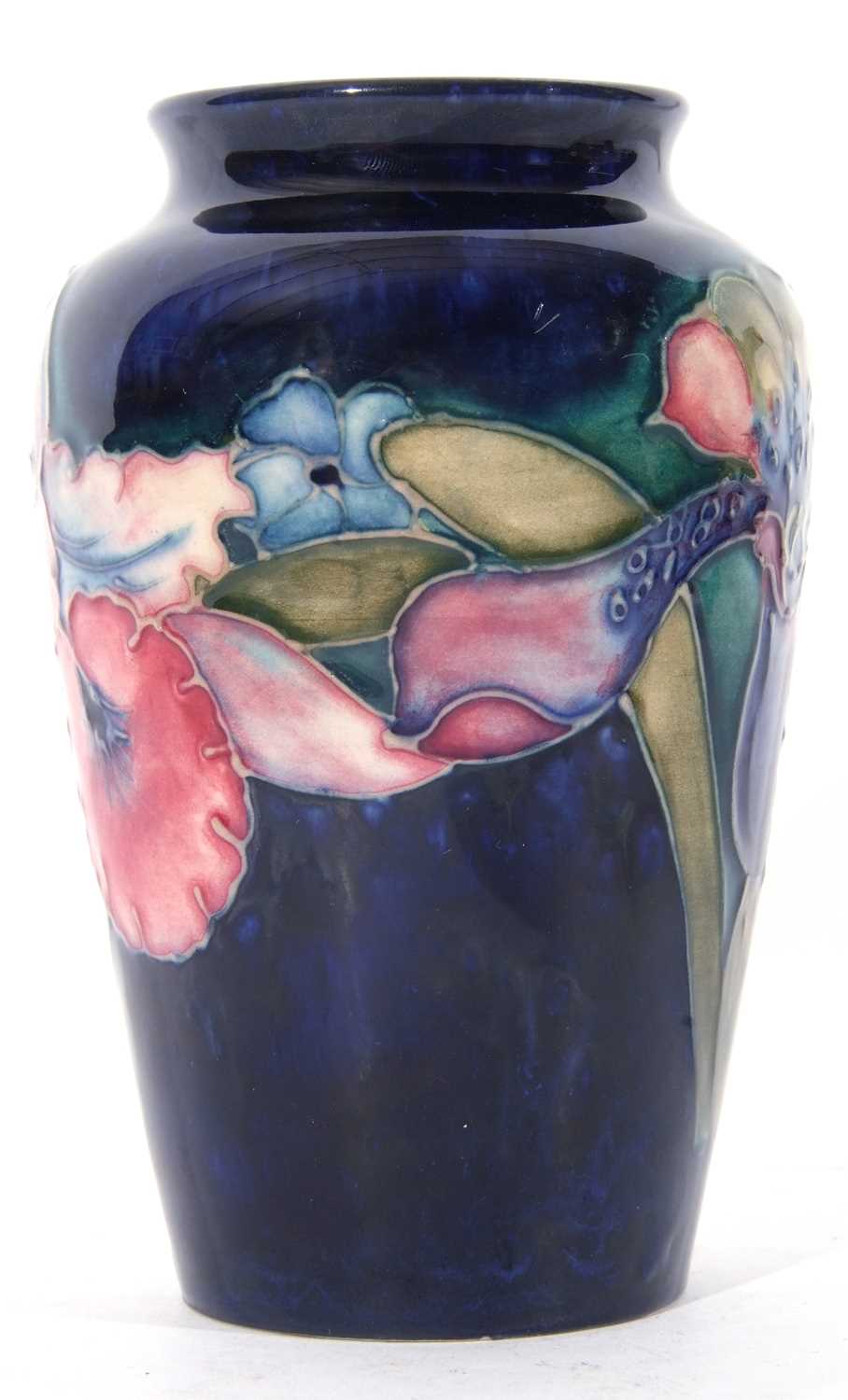 Moorcroft vase in the orchid pattern on blue ground, mid-20th century - Image 2 of 4