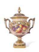 Large Royal Worcester vase with reticulated cover and gilt handles, the vase finely painted with