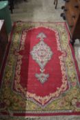 FLOOR RUG, MAINLY RED WITH CENTRAL LOZENGE, (A/F)
