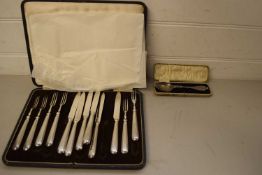 CASED SET OF SILVER PLATED DESSERT KNIVES AND FORKS TOGETHER WITH A FURTHER CASED COMMEMORATIVE