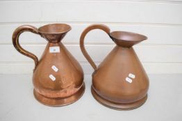 TWO LARGE COPPER MEASURING JUGS