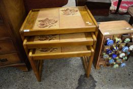 NEST OF THREE RETRO TILE TOP TABLES, LARGEST 59CM WIDE