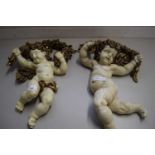 PAIR OF MODERN COMPOSITION MODELS OF CHERUBS WITH GARLANDS