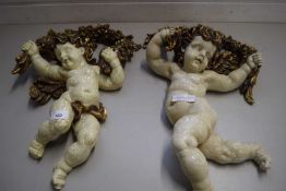 PAIR OF MODERN COMPOSITION MODELS OF CHERUBS WITH GARLANDS