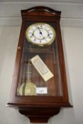 COMITTI OF LONDON MODERN WALL CLOCK IN GLAZED MAHOGANY CASE