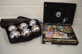 CASED SET OF FRENCH METAL BOULE BALLS TOGETHER WITH AN ARTISTS PAINT TIN (2)