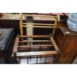 VICTORIAN MAHOGANY CANTERBURY MAGAZINE RACK, 56CM WIDE TOGETHER WITH A WOODEN TOWEL RAIL (2)