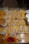 MIXED LOT OF CLEAR DRINKING GLASSES, SMALL RED MURANO GLASS VASE ETC