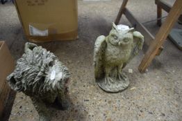 TWO CONCRETE GARDEN ORNAMENTS, ONE FORMED AS A TERRIER, THE OTHER AS AN OWL