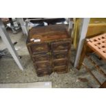 SMALL HARDWOOD EIGHT-DRAWER CHEST, 29CM WIDE