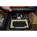 CASED ELECTRIC TYPEWRITER