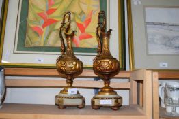 PAIR OF 20TH CENTURY GILT METAL EWERS SET ON MARBLE STAND