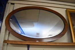 OVAL BEVELLED WALL MIRROR IN MAHOGANY FRAME, 84CM WIDE