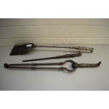 SET OF THREE FIRE IRONS COMPRISING TONGS, POKER AND SHOVEL, THE HANDLES FORMED AS BOOTS