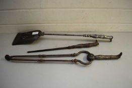 SET OF THREE FIRE IRONS COMPRISING TONGS, POKER AND SHOVEL, THE HANDLES FORMED AS BOOTS