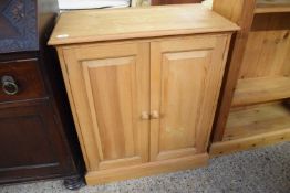 MODERN PINE TWO-DOOR CUPBOARD