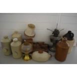 COLLECTION OF STONEWARE HOT WATER BOTTLES, FLAGONS, METAL BASED OIL LAMP, TABLE LAMP WITH WOODEN