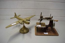 BRASS MODEL OF AN AEROPLANE AND A CHILD'S SEWING MACHINE (2)