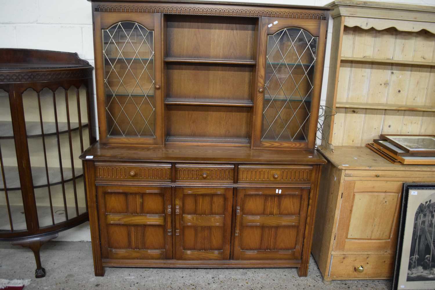 ERCOL DARK ELM SIDE CABINET WITH LEAD GLAZED TOP SECTION AND BASE WITH THREE DOORS AND THREE