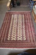 20TH CENTURY WOOL FLOOR RUG DECORATED WITH GEOMETRIC DESIGNS AND A LARGE PALE CENTRAL PANEL