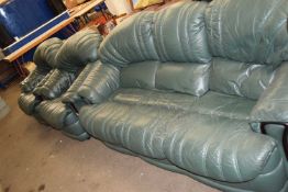 GREEN LEATHER THREE SEATER SOFA TOGETHER WITH TWO ARMCHAIRS AND A FOOTSTOOL (4)