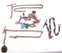 Mixed Lot: silver watch chain, trombone and link design, suspending a silver framed swivel fob, a