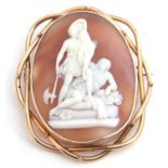 Victorian large carved shell cameo brooch depicting a family group standing with a man lying down,