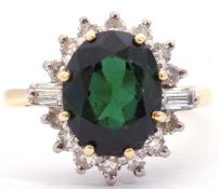 18ct gold green tourmaline an diamond cluster ring, the oval faceted tourmaline multi-claw set