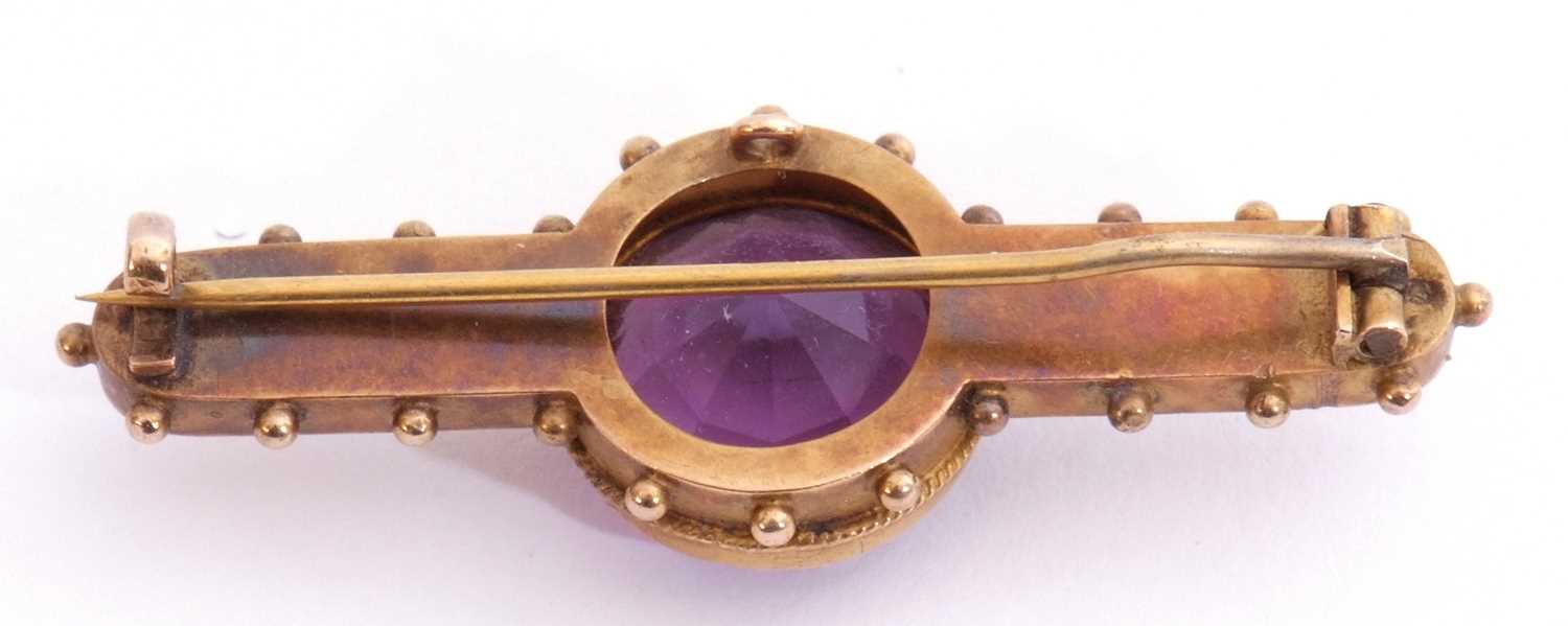 Antique Etruscan amethyst brooch centring a round faceted amethyst, 14mm diam, in a cut down - Image 2 of 2