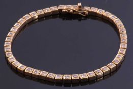 Diamond line bracelet featuring 45 small diamonds, individually claw set in articulated box