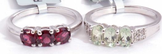 Mixed Lot: a Rajasthan garnet three stone ring, a lemon amblygonite and white topaz ring, both