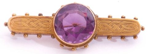 Antique Etruscan amethyst brooch centring a round faceted amethyst, 14mm diam, in a cut down