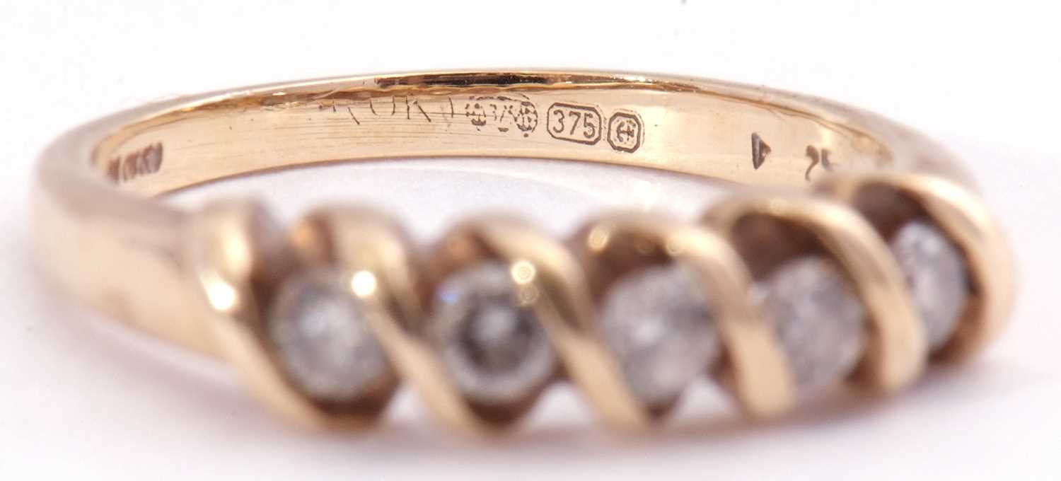 Modern 9ct gold five stone diamond ring featuring five small round cut diamonds between an S-bar - Image 6 of 7