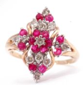 Modern ruby and diamond dress ring of marquis shape, featuring 14 small rubies and 11 small