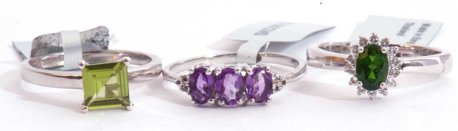 Mixed Lot: Changbai peridot ring, a Zambian amethyst and white topaz ring, together with a chrome