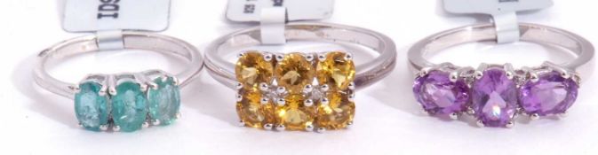 Mixed Lot: amethyst and white topaz ring, a golden beryl and diamond cluster ring, together with a