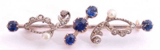 Sapphire, diamond and seed pearl brooch of open work design featuring five round cut sapphires and