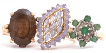 Mixed Lot: a smoky quartz dress ring, stamped 9ct, size L, a diamond and emerald cluster ring,