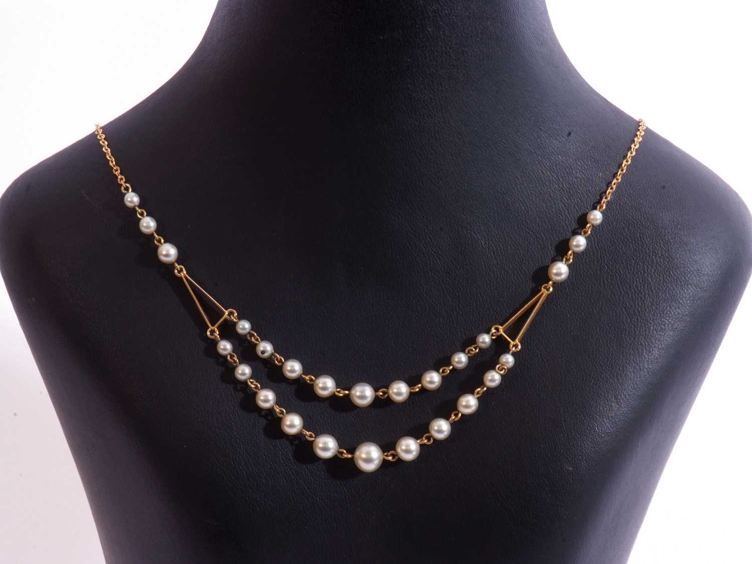 Modern double row simulated pearl necklace, a design with graduated grey pearls suspended from