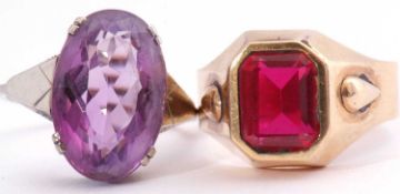 Mixed Lot: a purple stone dress ring of oval faceted shape, four claw set in a white metal mount,