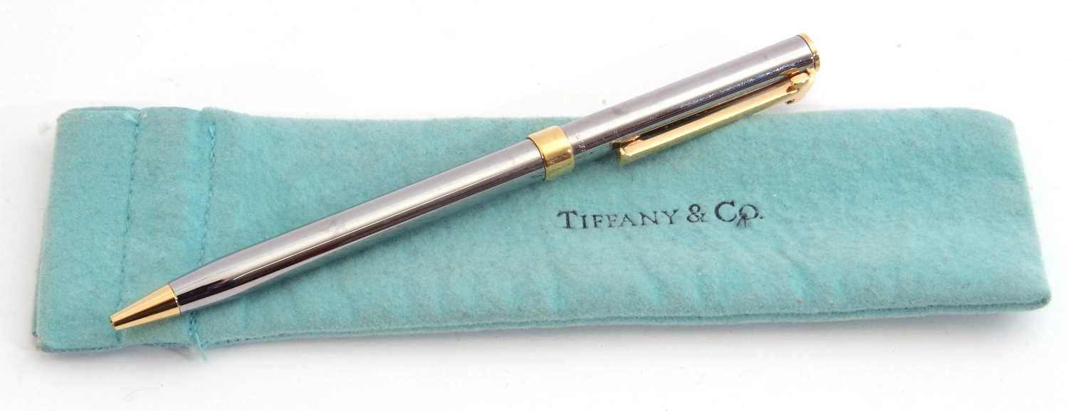 Tiffany & Co stainless steel ballpoint pen with gilt metal T-shaped clip and mounts, engraved '