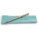 Tiffany & Co stainless steel ballpoint pen with gilt metal T-shaped clip and mounts, engraved '